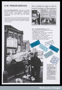 L0052097 Three protestors stand on a pavement, one in the act of