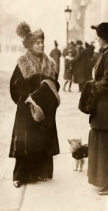 Emmeline Pankhurst talking to Grace Roe, c.1912. Emmeline Pankhurst and Grace Roe talking in the street; manuscript inscription on reverse in Olive Bartels' writing 'Mrs Pankhurst with Christabel's little dog talking to Grace Roe in France (probably Paris)'. Part of the image has torn away. LSE, 7JCC/O/02/148